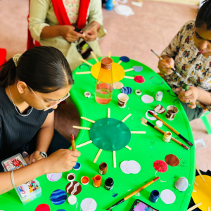 Children making friendship bracelets